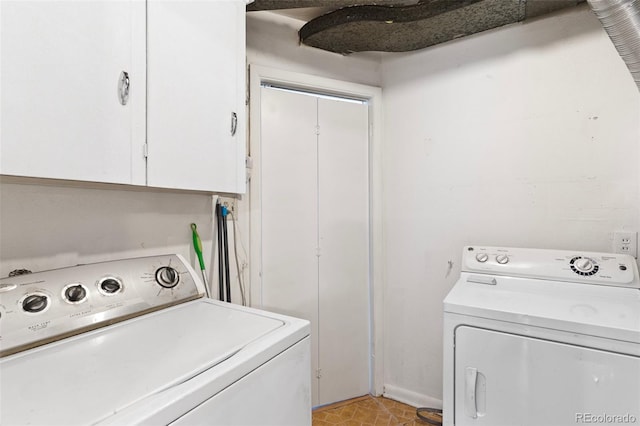 laundry area featuring cabinets and separate washer and dryer