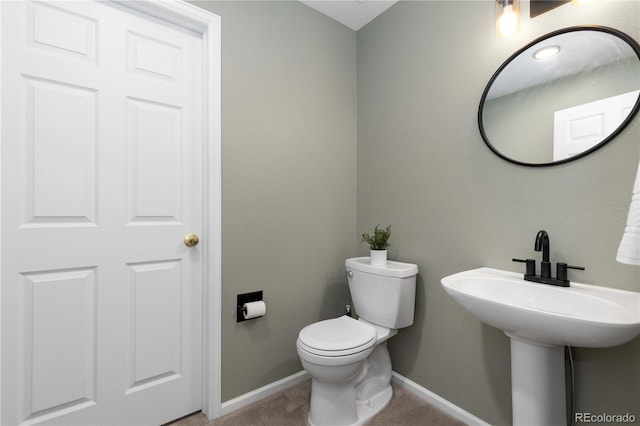 10183 Grove Loop Unit D, Westminster, CO 80031 - half bathroom featuring baseboards and toilet