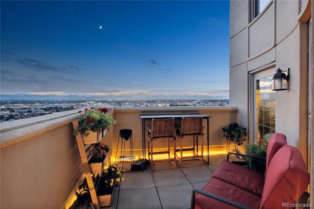 view of balcony at dusk