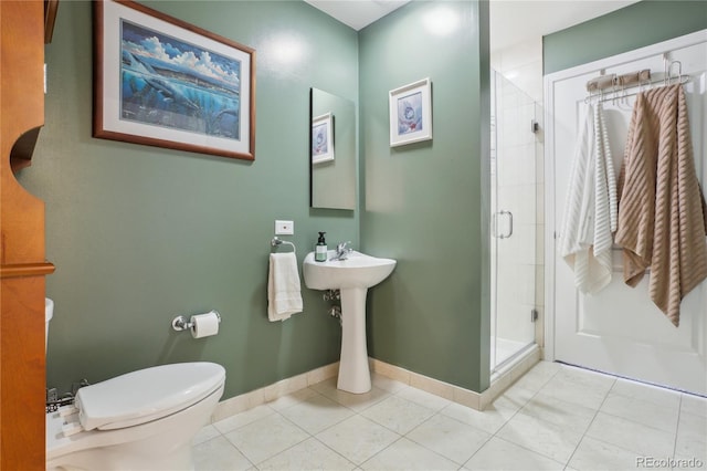 bathroom featuring toilet, tile patterned flooring, and walk in shower