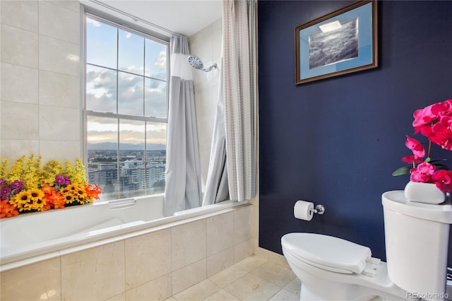 bathroom with tile patterned floors, toilet, and shower / tub combo