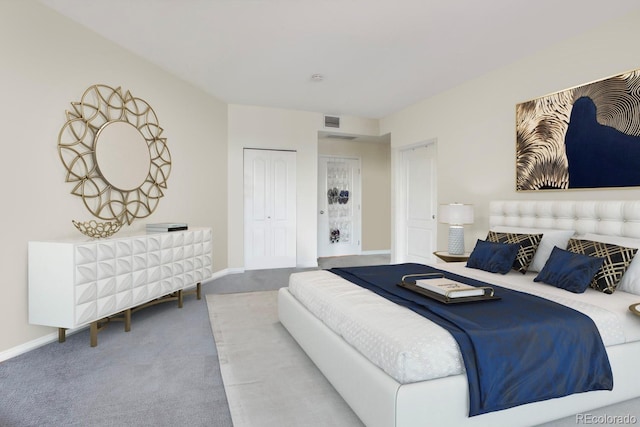 carpeted bedroom featuring a closet