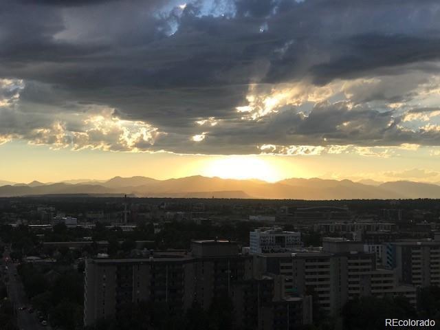 property's view of city with a mountain view