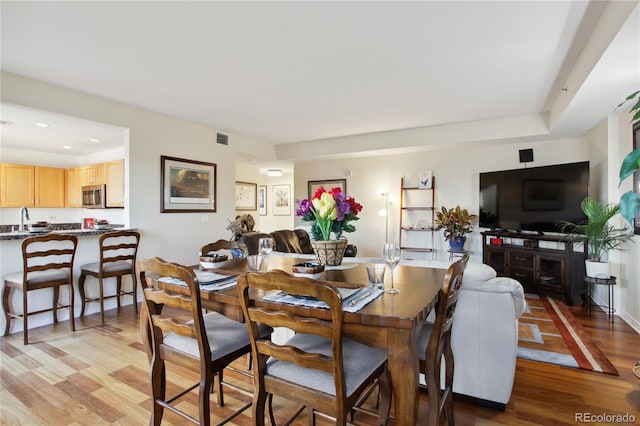 300 W 11th Ave Unit 18C, Denver, CO 80204 - dining room with light wood finished floors and recessed lighting
