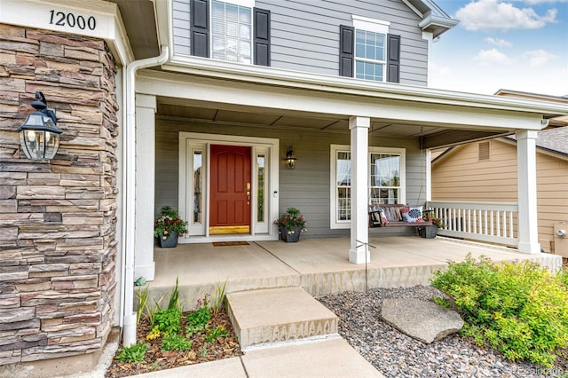 12000 Horseshoe Ln, Parker, CO 80138 - property entrance with a porch and stone siding