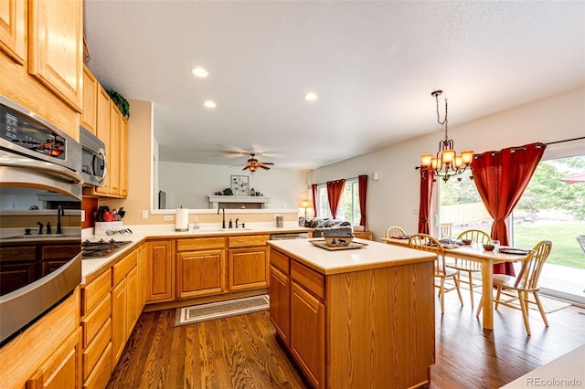 12000 Horseshoe Ln, Parker, CO 80138 - kitchen with a sink, dark wood-style floors, a chandelier, light countertops, and a ceiling fan