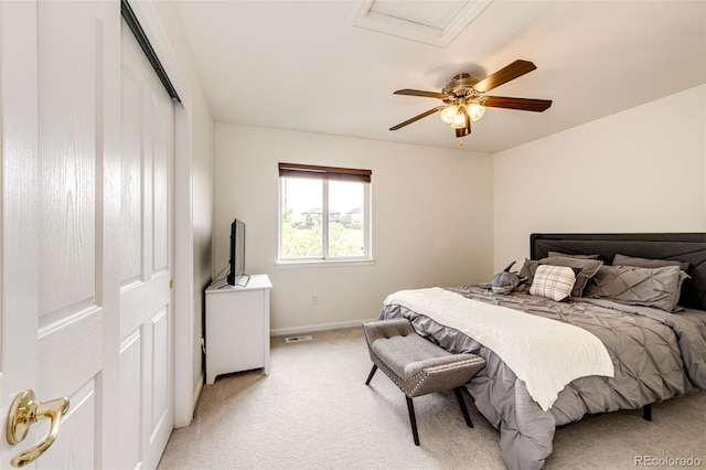 12000 Horseshoe Ln, Parker, CO 80138 - bedroom with light carpet, baseboards, a closet, a ceiling fan, and attic access