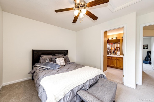 12000 Horseshoe Ln, Parker, CO 80138 - bedroom featuring light colored carpet, ensuite bath, ceiling fan, and baseboards