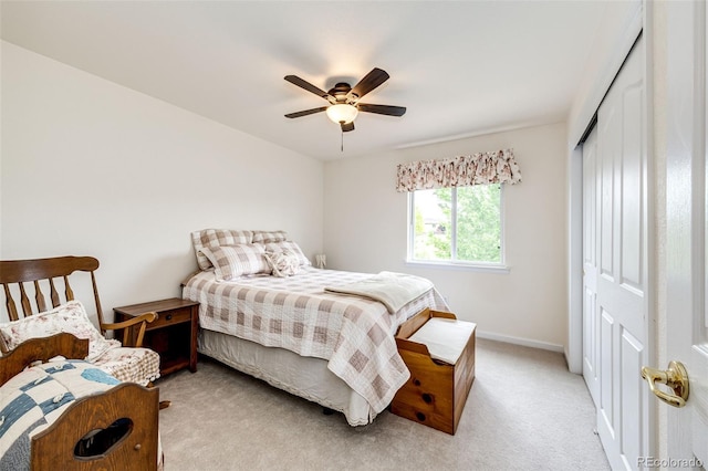 12000 Horseshoe Ln, Parker, CO 80138 - bedroom featuring light carpet, baseboards, a closet, and a ceiling fan
