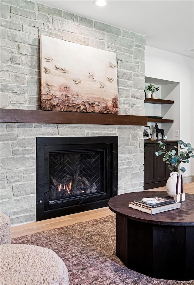 5290 Nassau Cir E, Cherry Hills Village, CO 80113 - details featuring a stone fireplace and wood finished floors