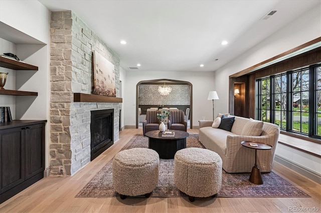 5290 Nassau Cir E, Cherry Hills Village, CO 80113 - living area with light wood-style floors, visible vents, arched walkways, and recessed lighting