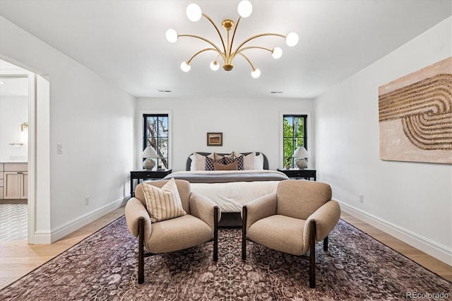 5290 Nassau Cir E, Cherry Hills Village, CO 80113 - bedroom with baseboards, visible vents, an inviting chandelier, and light wood-type flooring
