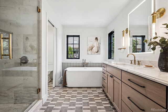 5290 Nassau Cir E, Cherry Hills Village, CO 80113 - full bath with toilet, a stall shower, a soaking tub, tile patterned floors, and vanity