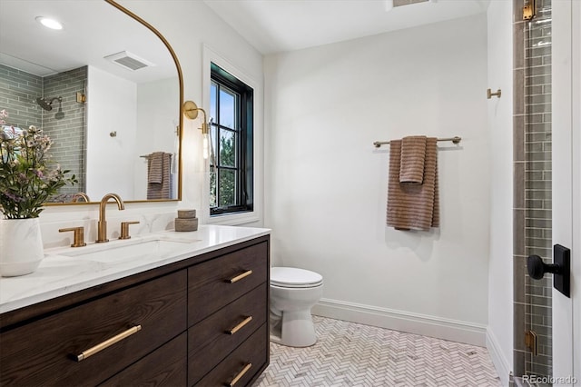 5290 Nassau Cir E, Cherry Hills Village, CO 80113 - bathroom with toilet, a tile shower, visible vents, baseboards, and vanity