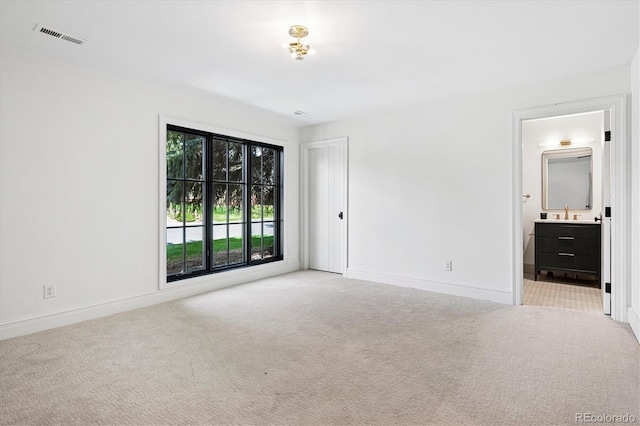 5290 Nassau Cir E, Cherry Hills Village, CO 80113 - spare room featuring baseboards, carpet flooring, visible vents, and a sink