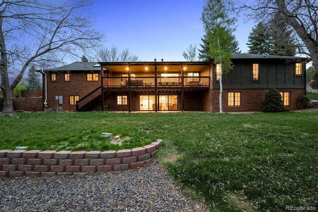 5290 Nassau Cir E, Cherry Hills Village, CO 80113 - back of property featuring a yard, a deck, stairway, and brick siding