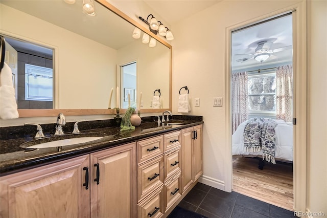 bathroom with ceiling fan, vanity, and tile patterned flooring