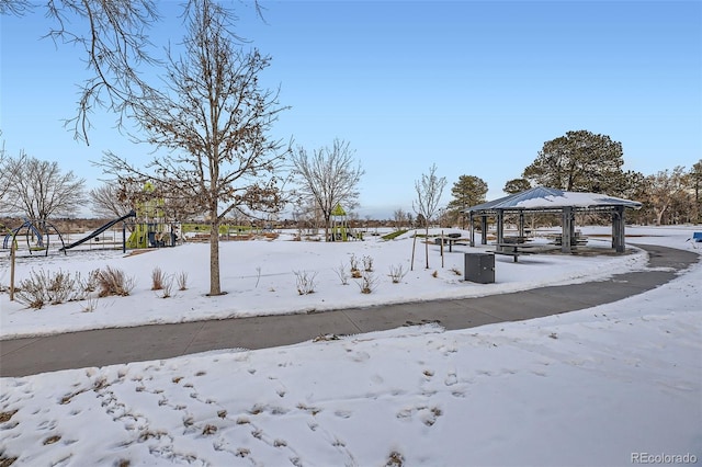 yard layered in snow with a gazebo