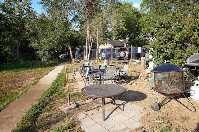 view of patio / terrace featuring a fire pit