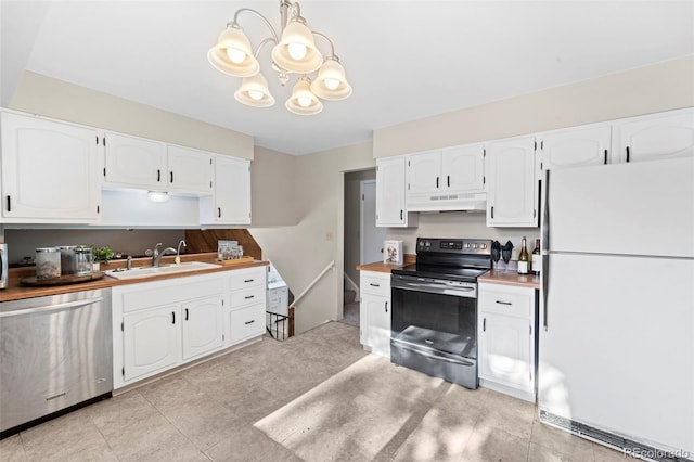 kitchen with a notable chandelier, sink, appliances with stainless steel finishes, white cabinets, and wood counters