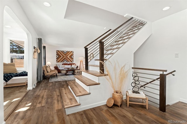 stairway with hardwood / wood-style floors