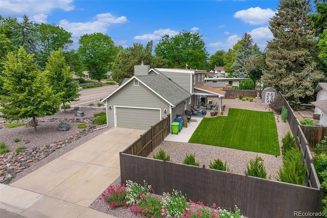 view of front of property featuring a garage and a front lawn