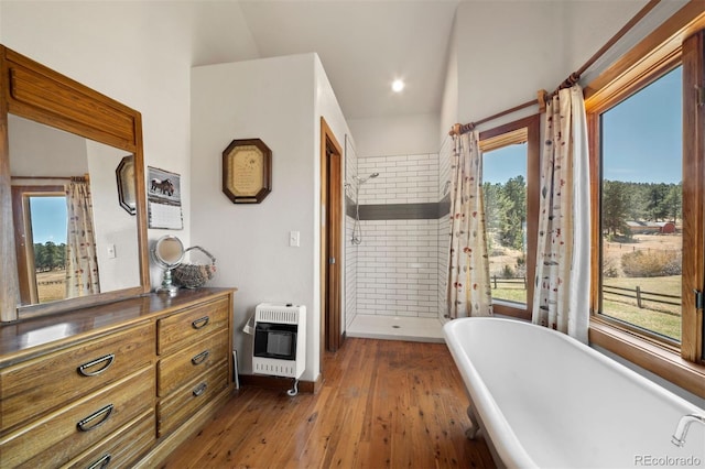 1740 County Road 72, Bailey, CO 80421 - bathroom featuring plenty of natural light, heating unit, a freestanding bath, and wood-type flooring