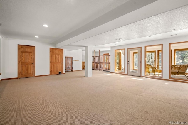 1740 County Road 72, Bailey, CO 80421 - interior space with light colored carpet, baseboards, a textured ceiling, and recessed lighting
