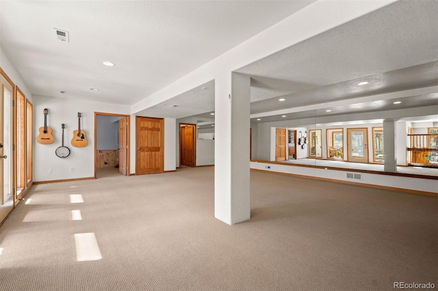 1740 County Road 72, Bailey, CO 80421 - below grade area featuring visible vents, baseboards, recessed lighting, and light colored carpet