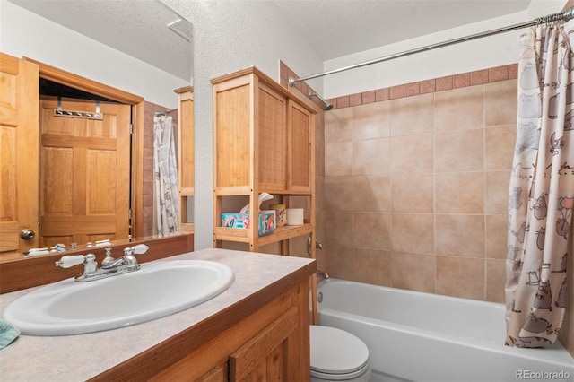 1740 County Road 72, Bailey, CO 80421 - full bathroom with a textured wall, toilet, vanity, shower / tub combo, and a textured ceiling