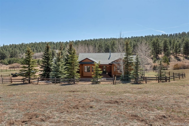 1740 County Road 72, Bailey, CO 80421 - log-style house featuring a rural view, fence private yard, a forest view, and metal roof