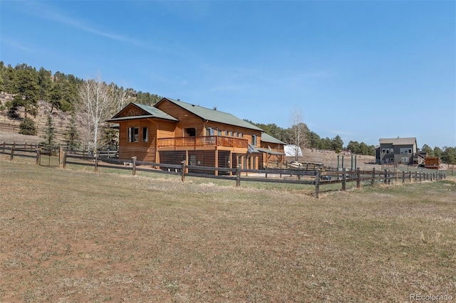 1740 County Road 72, Bailey, CO 80421 - back of house featuring fence and a lawn