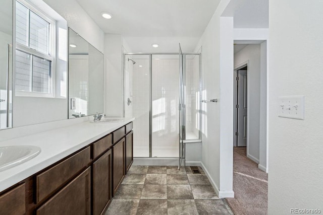 bathroom featuring vanity and walk in shower