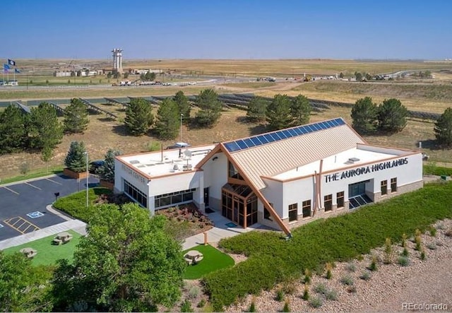 birds eye view of property with a rural view