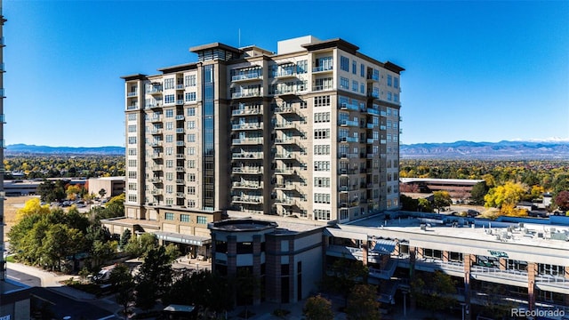 view of building exterior featuring a mountain view