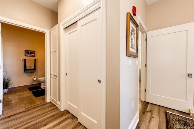 corridor featuring light hardwood / wood-style flooring