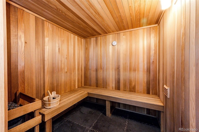 view of sauna / steam room with wood ceiling and wood walls