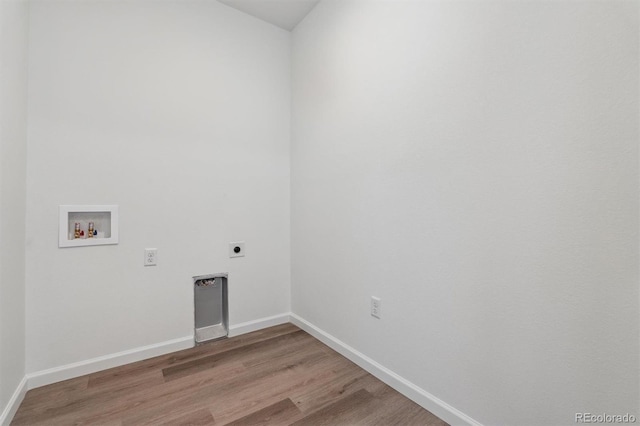 9662 Cathay St, Commerce City, CO 80022 - laundry area with laundry area, light wood-type flooring, baseboards, electric dryer hookup, and washer hookup