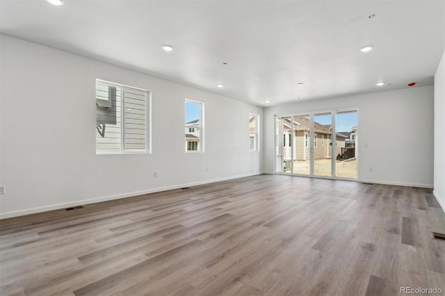 9662 Cathay St, Commerce City, CO 80022 - unfurnished room featuring light wood-type flooring, baseboards, visible vents, and recessed lighting
