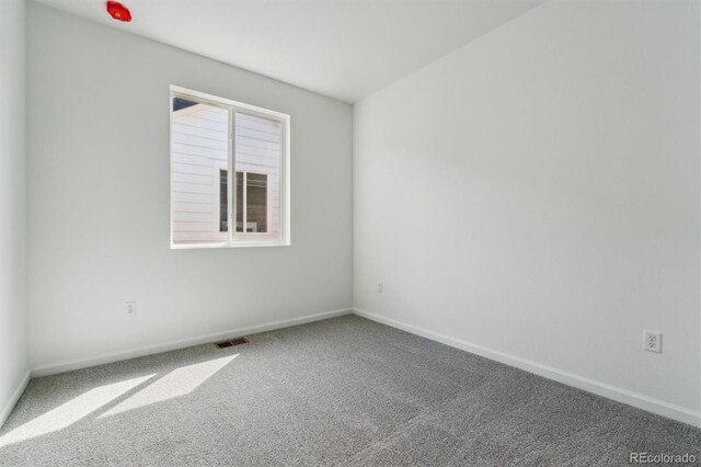 9662 Cathay St, Commerce City, CO 80022 - carpeted spare room featuring visible vents and baseboards