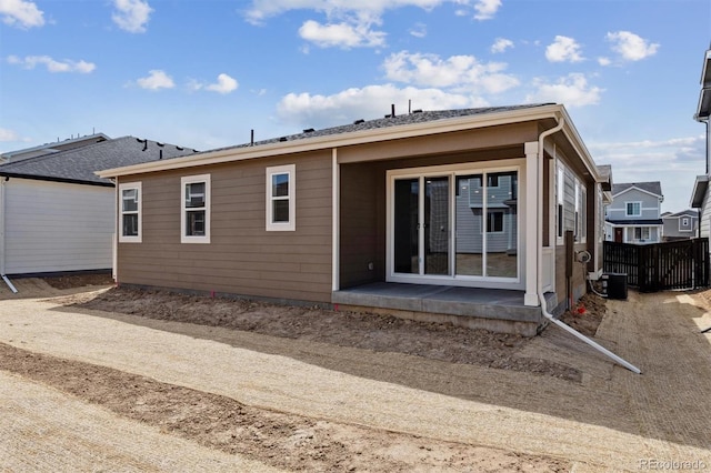 9662 Cathay St, Commerce City, CO 80022 - rear view of house with fence and central AC unit