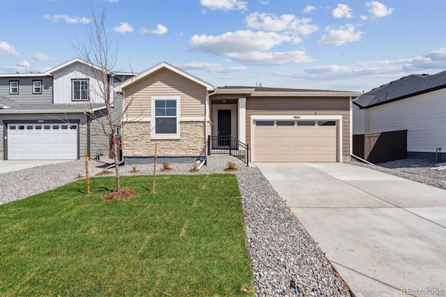 9662 Cathay St, Commerce City, CO 80022 - view of front of home with a garage, driveway, stone siding, and a front lawn