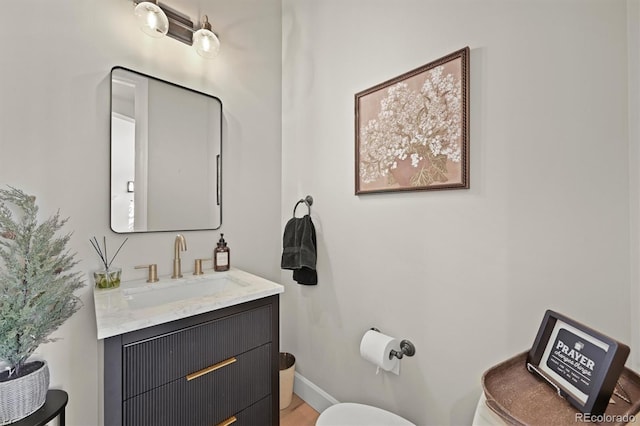 1287 Buffalo Ridge Rd, Castle Pines, CO 80108 - bathroom with toilet, vanity, and baseboards