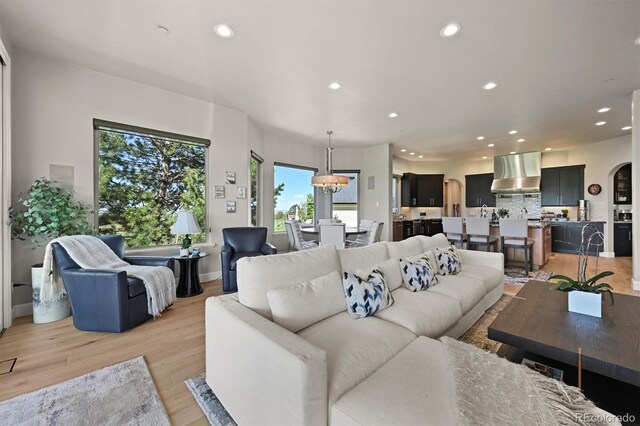 1287 Buffalo Ridge Rd, Castle Pines, CO 80108 - living room with recessed lighting, light wood-style floors, and baseboards