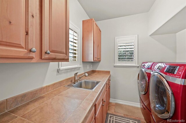 1287 Buffalo Ridge Rd, Castle Pines, CO 80108 - washroom featuring washer and dryer, healthy amount of natural light, cabinet space, and baseboards