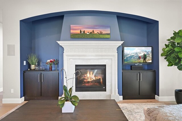 1287 Buffalo Ridge Rd, Castle Pines, CO 80108 - living room with wood finished floors, a fireplace, and baseboards
