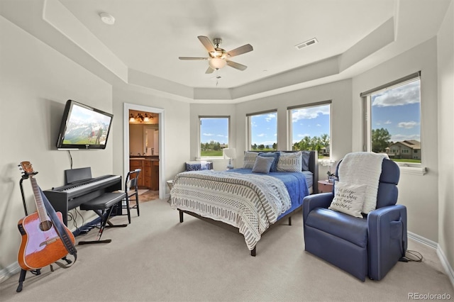 1287 Buffalo Ridge Rd, Castle Pines, CO 80108 - bedroom with a raised ceiling, light carpet, baseboards, ceiling fan, and ensuite bathroom