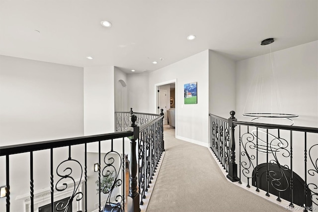 1287 Buffalo Ridge Rd, Castle Pines, CO 80108 - hall with an upstairs landing, carpet, recessed lighting, and baseboards