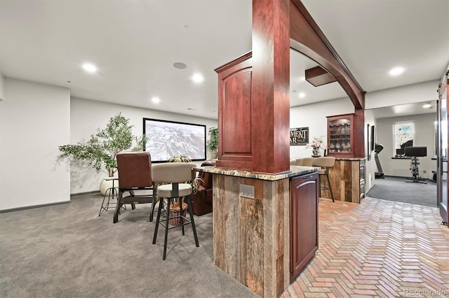 1287 Buffalo Ridge Rd, Castle Pines, CO 80108 - bar area with recessed lighting, baseboards, brick floors, and light carpet