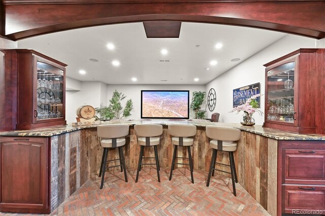 1287 Buffalo Ridge Rd, Castle Pines, CO 80108 - indoor wet bar with brick floors and recessed lighting